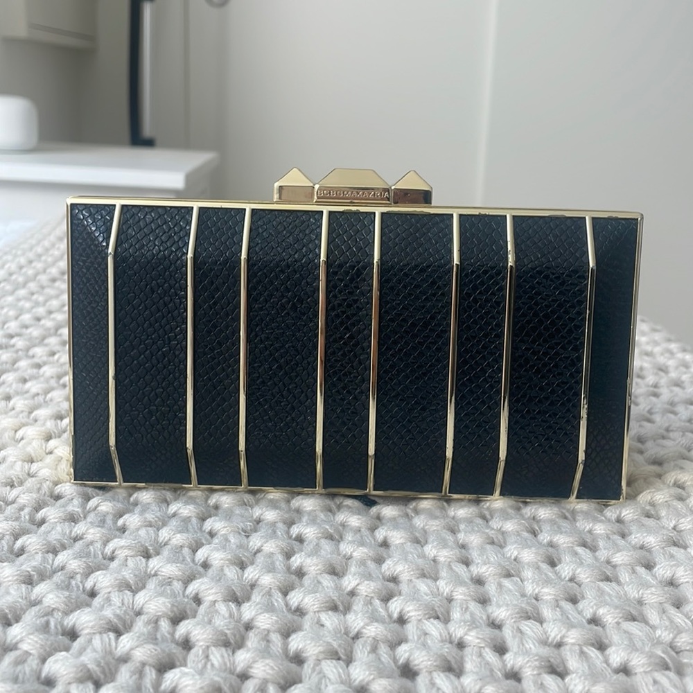 NWT BCBG MaxAzria Clutch with gold chain. Dust bag included